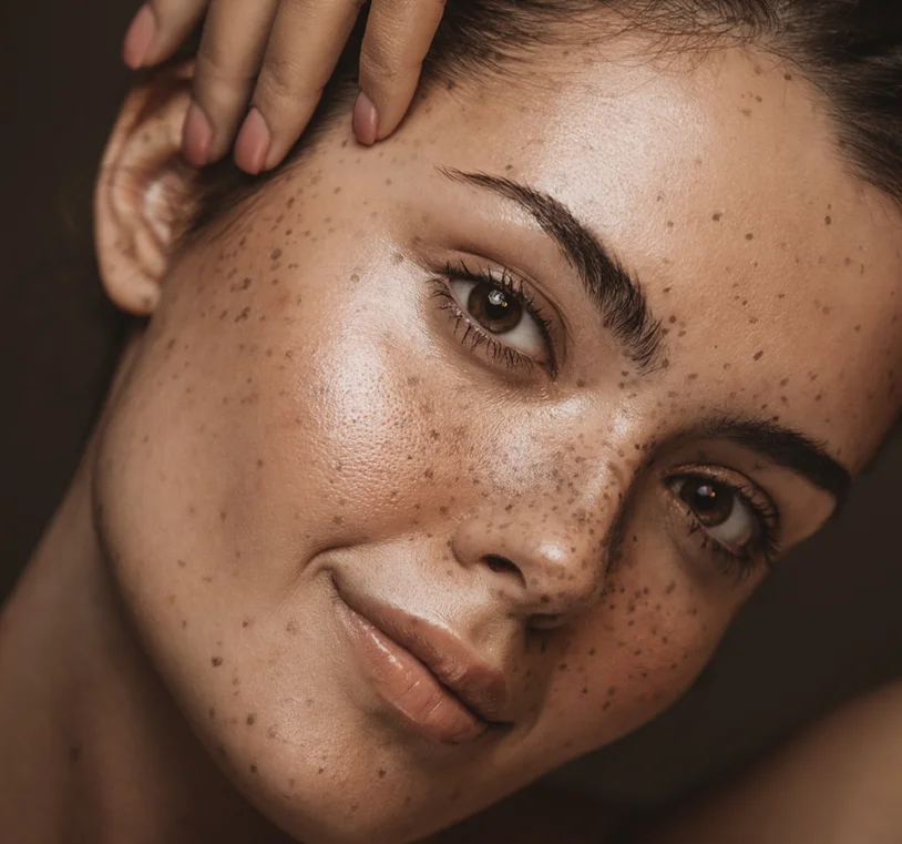 Close up portrait of a brunette woman with perfect skin and smile